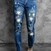 Daisy Leopard Patchwork Distressed Straight Leg Jeans