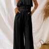 Seductive Strapless Black Jumpsuit With Ruffled Overlay And Attached Belt