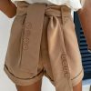 Brown Button Decor Belt Rolled Hem Shorts