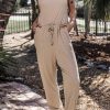 Versatile Sleeveless Jumpsuit: Adjustable Drawstring Waist And Side Pockets