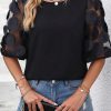 Stylish Round Neck Blouse: Feminine And Edgy Style In Black