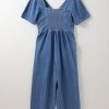 Women's Ashleigh Blue V Neck Short Sleeve Denim Loose Jumpsuit with Smocked Back - Image 7