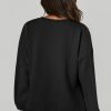 Women's Black Solid Pullover Sweatshirt with O Neck and High Low Hem - Image 2