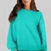 Women's Aruba Blue Solid O-Neck High Low Hem Pullover Sweatshirt - Image 3