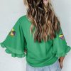 Chic Women's Green Sequin Doughnut Graphic Blouse with Ruffled Trim and Bell Sleeves for Mardi Gras - Image 2