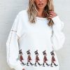 Women's Festive White Nutcracker Doll Graphic Sweatshirt with Colorful Stitch Trim - Image 5