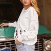 Women's Festive White Nutcracker Doll Graphic Sweatshirt with Colorful Stitch Trim - Image 9