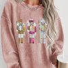 Women's Pink Oversized Sweatshirt with Festive Nutcracker Pattern - Image 2