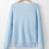 Women's Light Blue Knitted Sweater with Floral Pattern and Ribbed Edge - Image 6