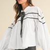 Women's Elegant White Shirt with Black Pipping, Ribbon Bowtie, and Ruffled Puff Sleeves - Image 3