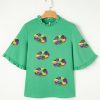 Chic Women's Green Sequin Doughnut Graphic Blouse with Ruffled Trim and Bell Sleeves for Mardi Gras - Image 7