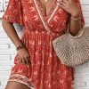 Women's Orange Plus Size Printed Surplice Neck Empire Waist Flowy Mini Dress - Image 2