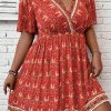 Women's Orange Plus Size Printed Surplice Neck Empire Waist Flowy Mini Dress - Image 5