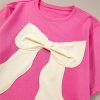 Women's Strawberry Pink Contrasting Color Ribbon Bow Front Loose Tee with Side Slits - Image 7