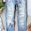 Women’s Light Blue Distressed Jeans with Sequin Bow and American Flag Pattern - Image 2