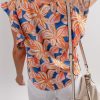Charming Women's Orange Summer Flower Print Blouse with Ruffle Sleeves - Image 2